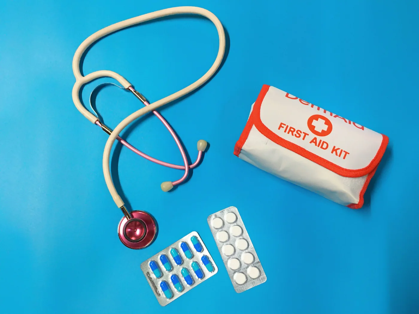 Illustrative first aid kit with medical supplies